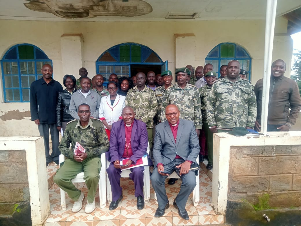 Church leaders and prison officers gathered during prison ministry